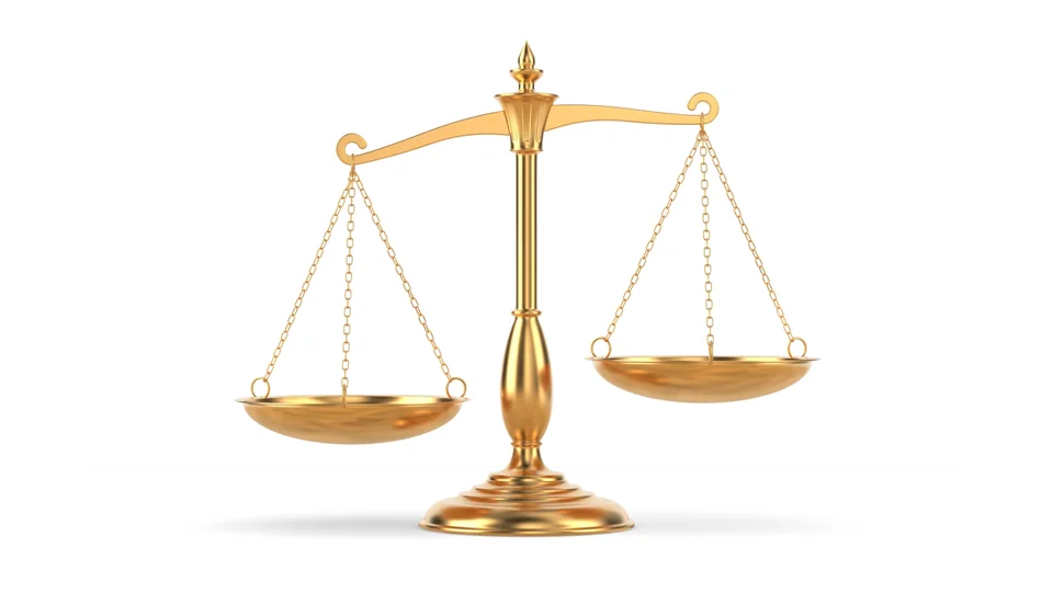 Gold balance scale representing the balance between marketing workload and team capacity